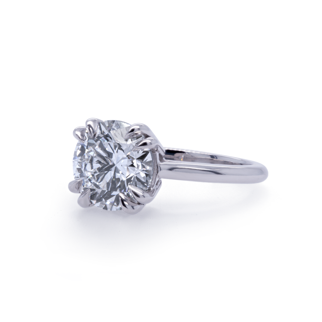 EOS engagement ring angled view, platinum six-prong solitaire with 3ct lab-grown diamond, by Janine Jewels.