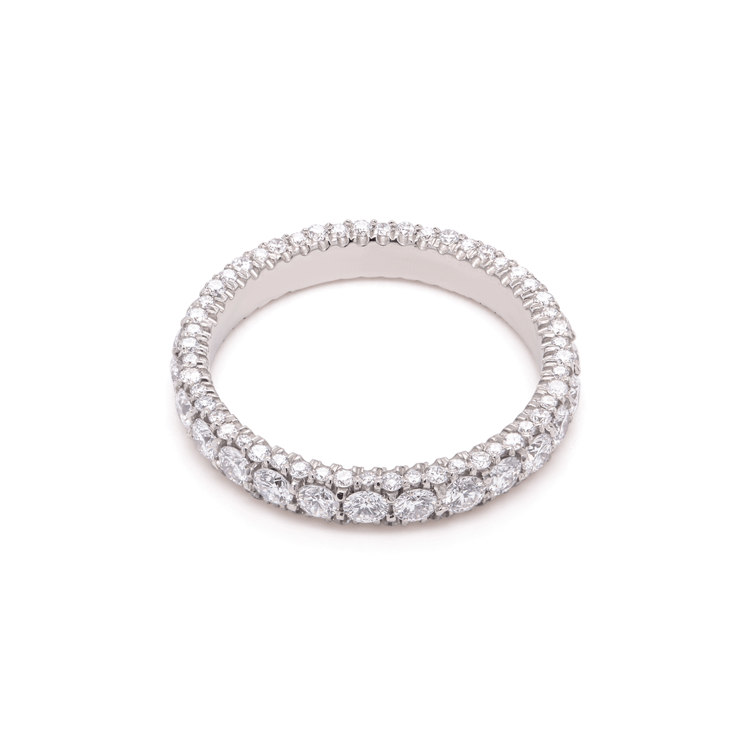 Unisex eternity band in platinum, shimmering with lab-grown diamonds. Shown on white background.