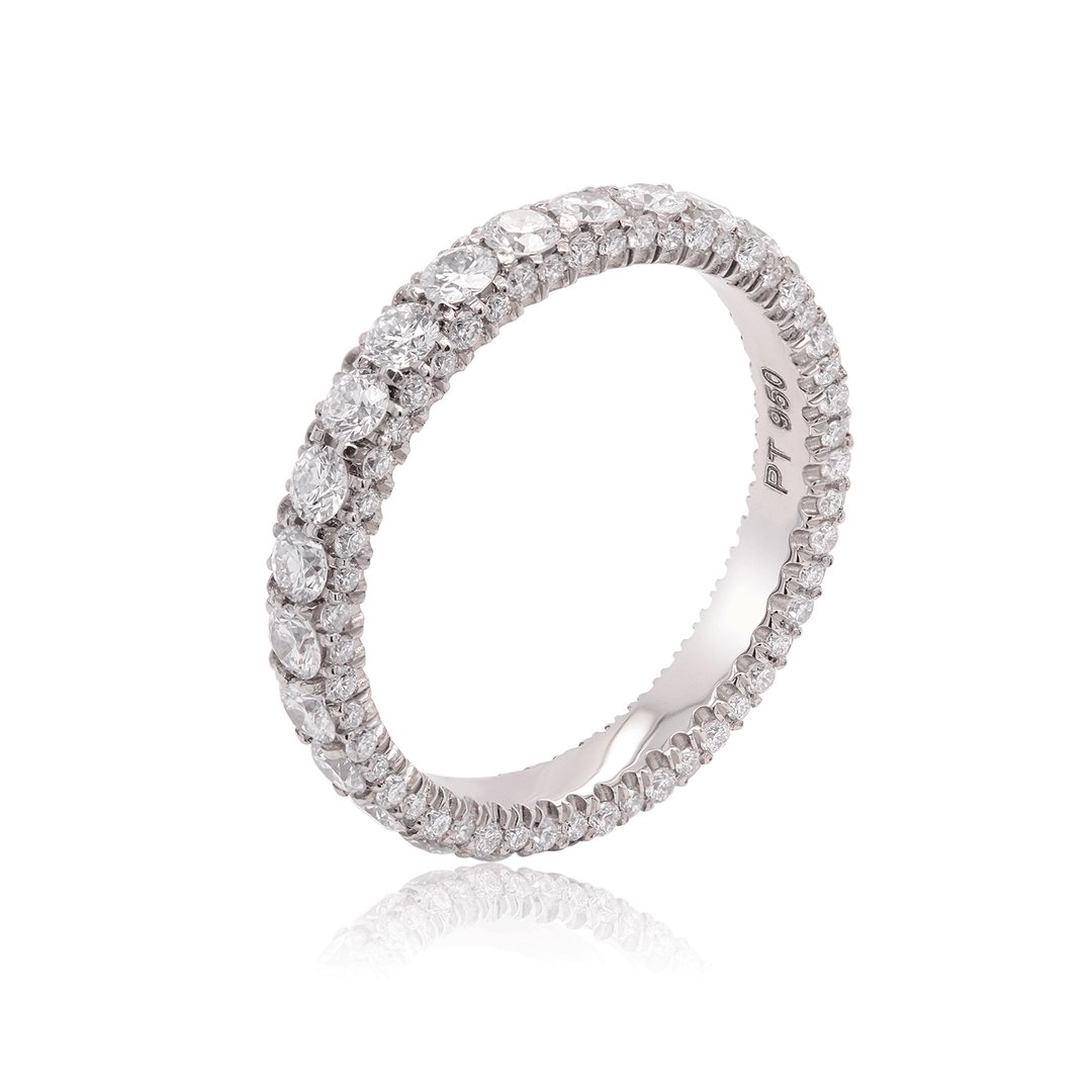 Three-sided platinum band adorned with lab-grown diamonds. 3 quarter view on white background.