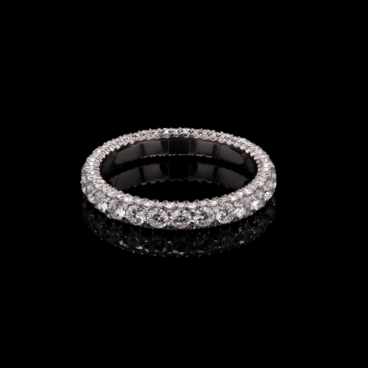 Three-sided platinum band adorned with lab-grown diamonds. Shown on a black background.