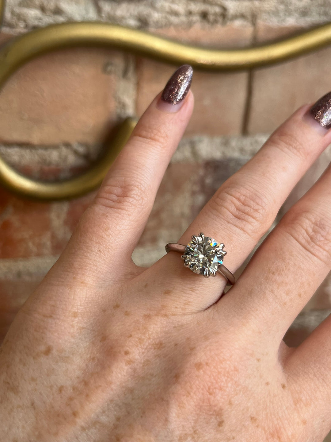 EOS engagement ring worn on model’s hand, platinum setting with 3ct lab-grown diamond, Janine Jewels Toronto.