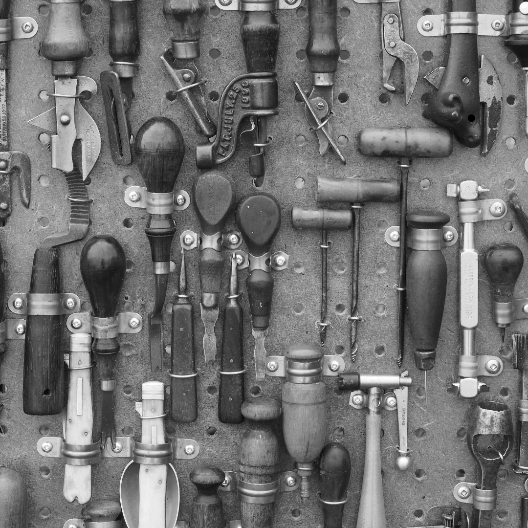 Medly of jewellery tools displayed on a peg board to allude to building your own jewellery course option.