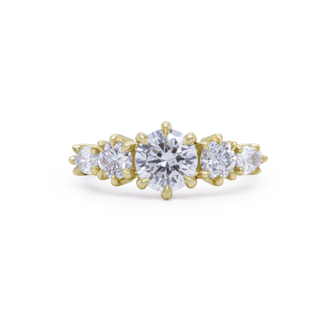 Aurea engagement ring in 18K yellow gold with a round brilliant diamond, handcrafted by Janine Jewels in Toronto.
