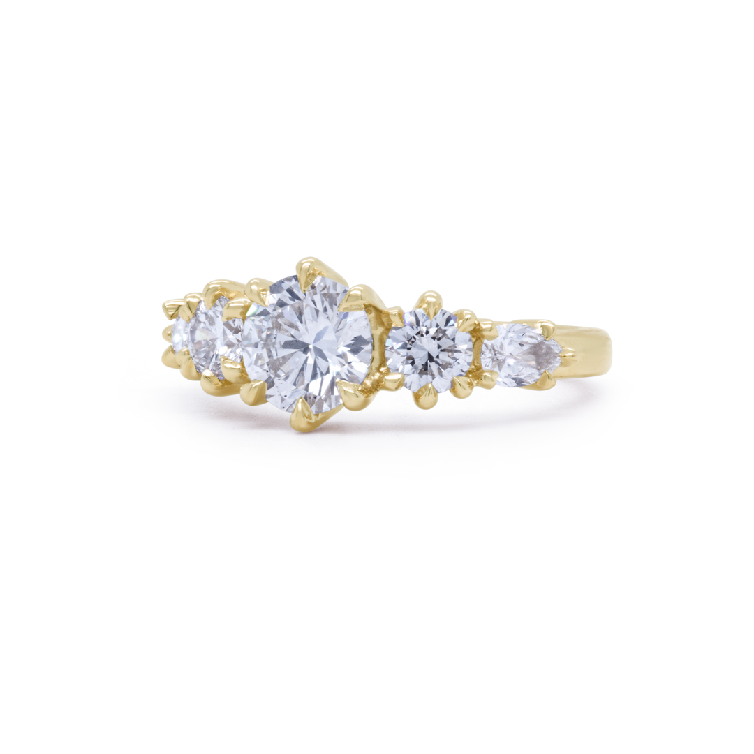 Detail of Aurea Ring diamond solitaire in a sleek gold mount, emphasizing craftsmanship and luxury design