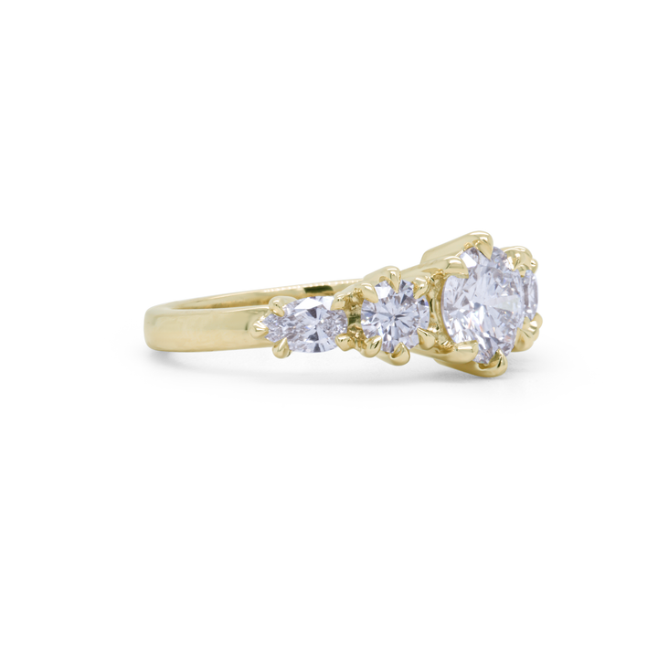 Side view of Aurea Ring showcasing the sculptural gold band and diamond setting, fine jewellery by Janine Jewels