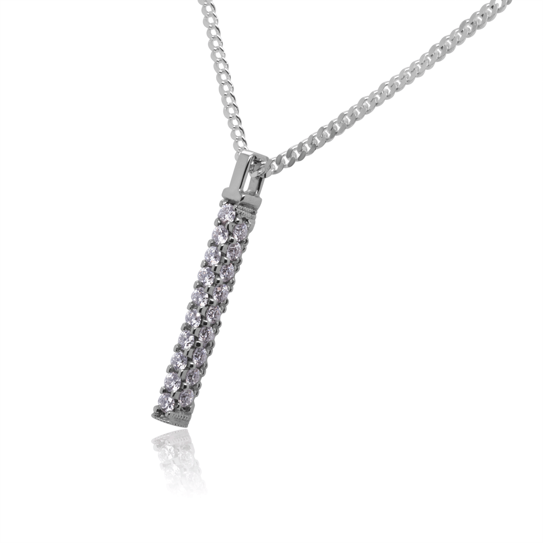 Platinum bar pendant pave-set with twenty-eight round moissanites, hangs on a sleek 2mm flat silver Cuban link chain. (White background). Side view.