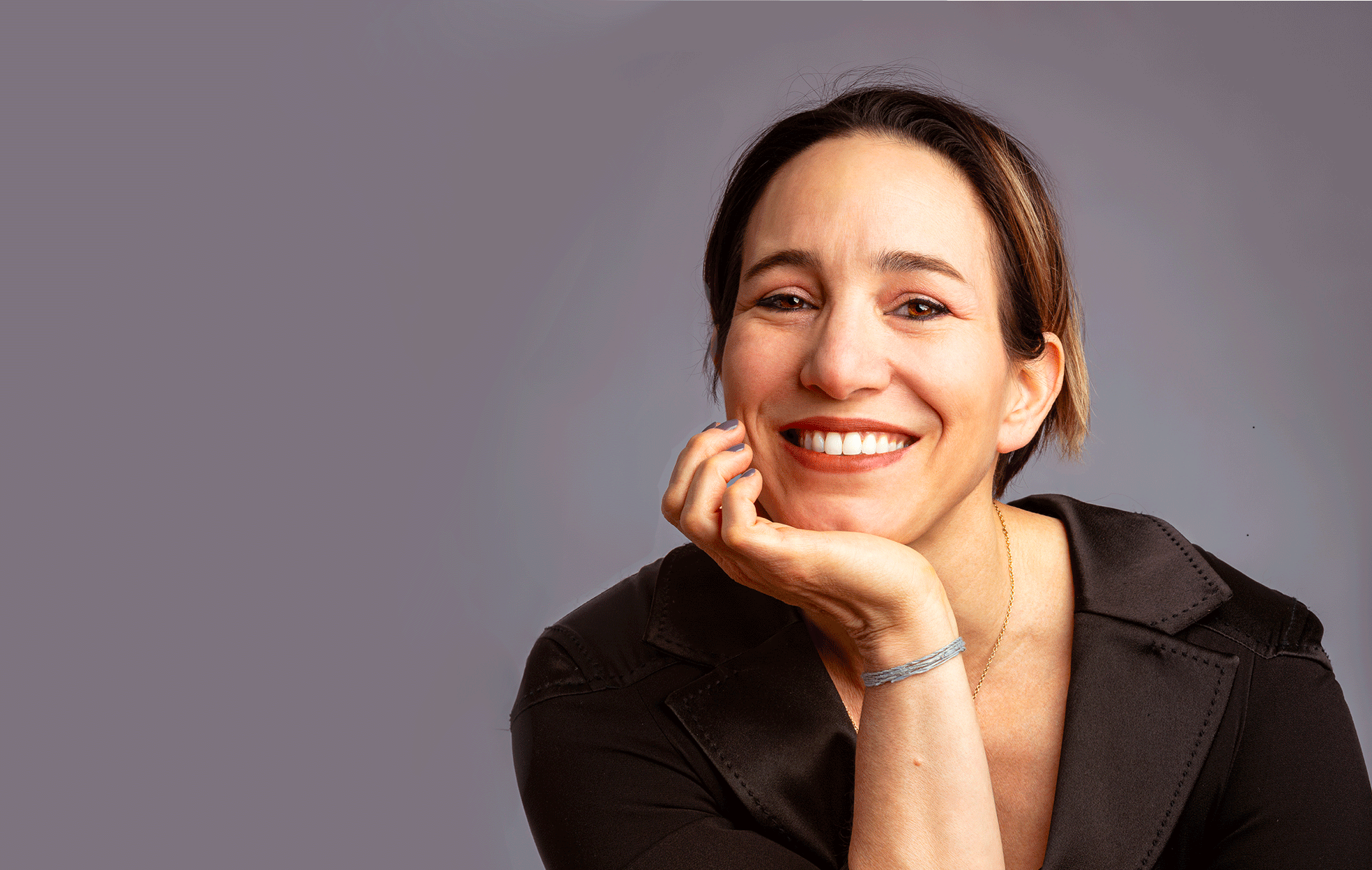 Sabrina, teacher and founder at Janine Jewels posing in studio for her bio picture