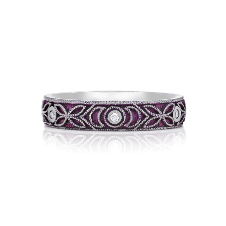 4mm titanium ring with purple anodized finish, featuring intricate floral and moon engraving. Includes six 1.3mm round white moissanite stones in bezel settings, designed for an active lifestyle and crafted with a blend of laser and hand engraving for a unique, vibrant look. On white background.