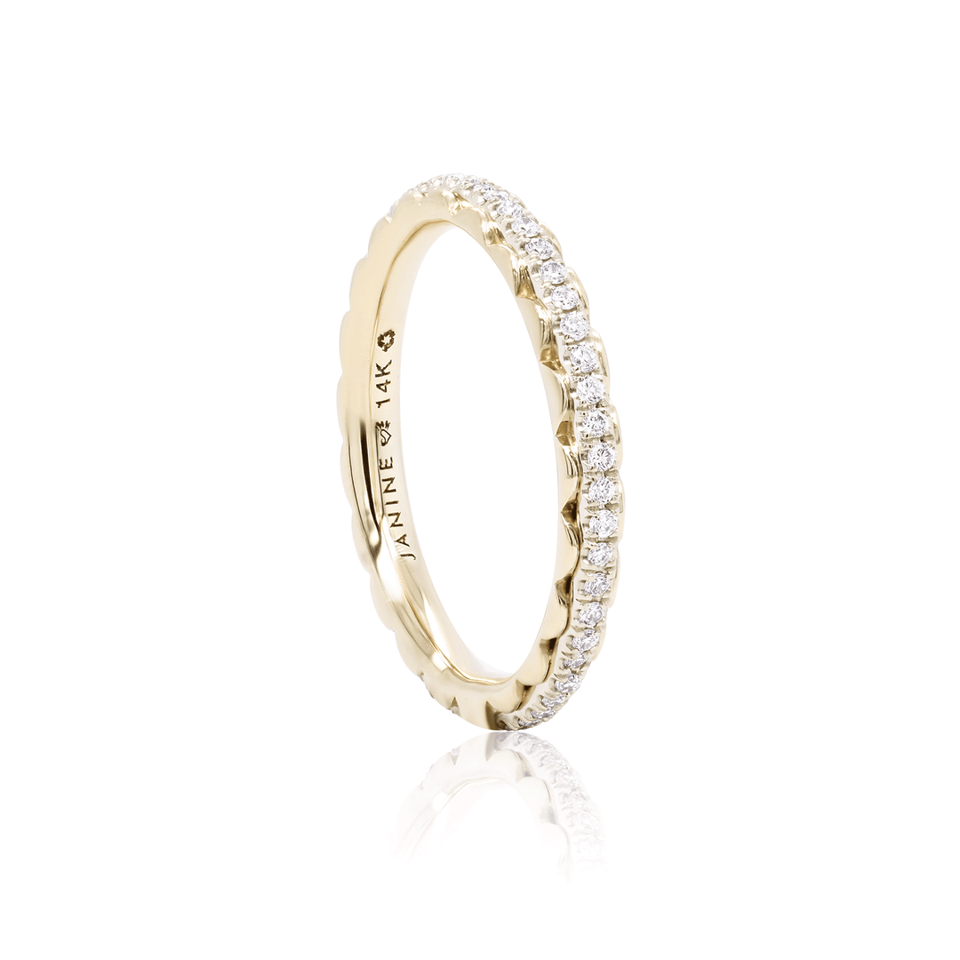 Two-tone eternity band with lab-grown diamonds. Delicate yellow gold details frame the white gold center.