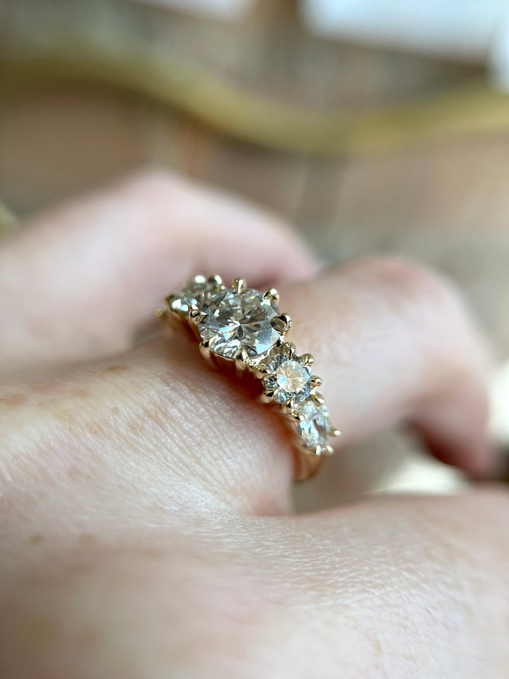 Aurea Ring worn as an engagement ring, elegant diamond and gold design styled by Toronto jeweller Janine Jewels