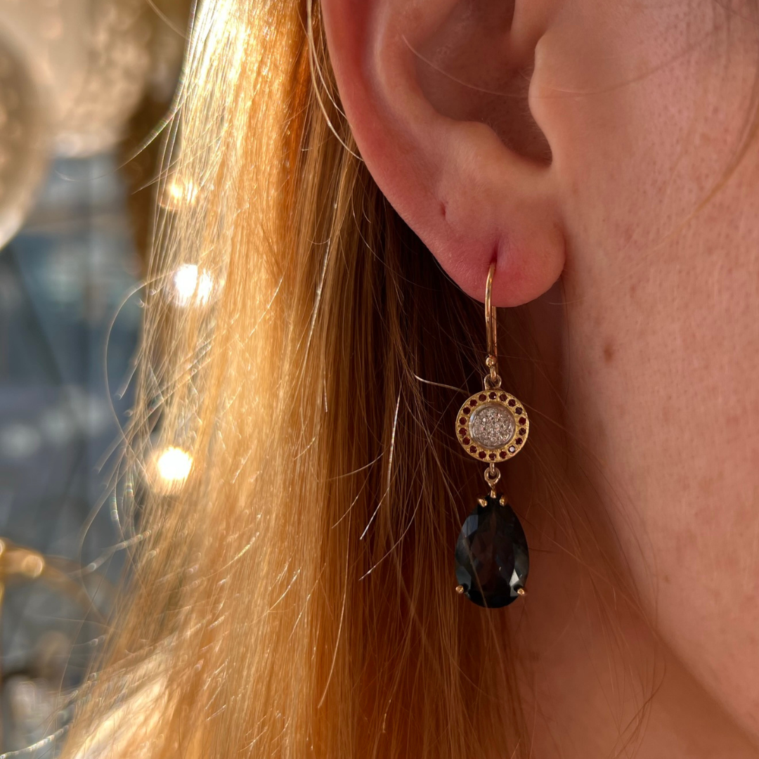 The pear-shaped drops – brings a modern sophistication to the vintage charm. These aren't just earrings; they're an elegant solution that preserves family history while breathing new life into treasured gems.