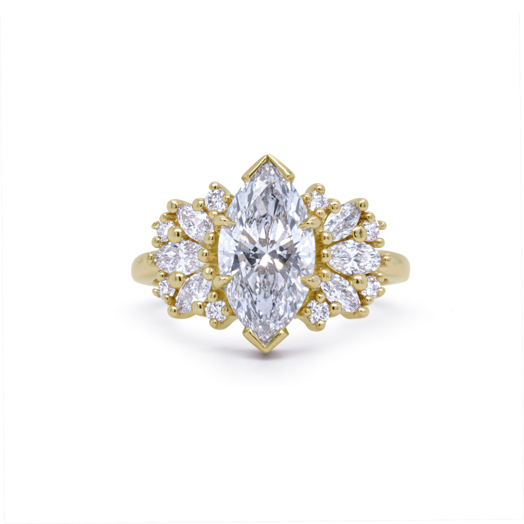 Clara engagement ring with 2ct marquise lab-grown diamond and 14K recycled yellow gold, surrounded by accent diamonds, Janine Jewels Toronto.