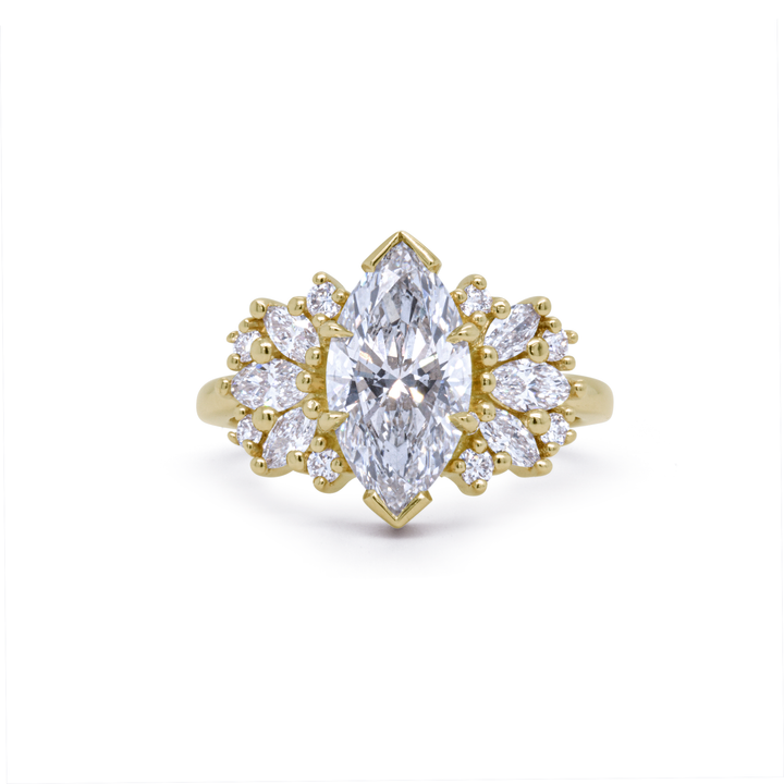 Clara engagement ring with 2ct marquise lab-grown diamond and 14K recycled yellow gold, surrounded by accent diamonds, Janine Jewels Toronto.