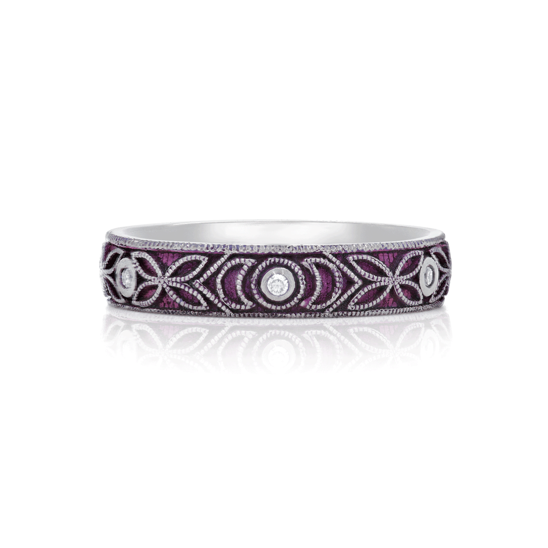 4mm titanium ring with purple anodized finish, featuring intricate floral and moon engraving. Includes six 1.3mm round white moissanite stones in bezel settings, designed for an active lifestyle and crafted with a blend of laser and hand engraving for a unique, vibrant look. On white background.