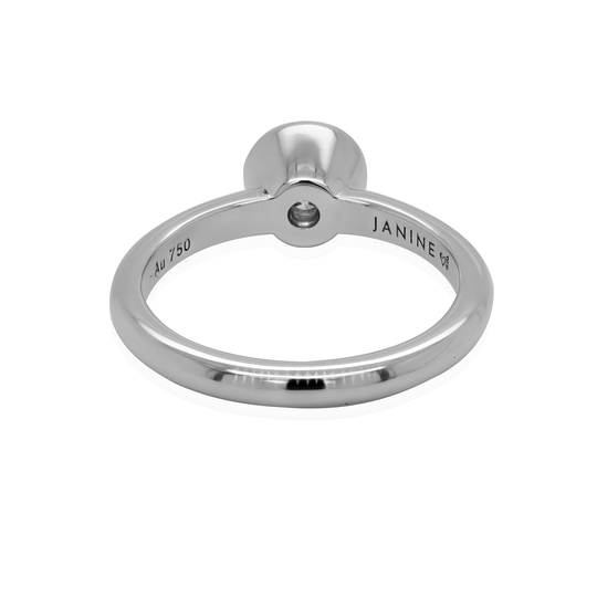  Elegant solitaire ring with a moissanite center stone. The ring is crafted from 18K white gold and offers a timeless design. Back View of ring.